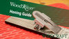 WoodRiver honing guide clamped to sharpening stone on red workbench mat