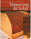 Book cover showing wood veneer samples with contrasting grain patterns and an intricate geometric inlay design