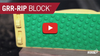 Close-up of MicroJig GRR-Rip Block pushblock with textured green grip for safe wood cutting.