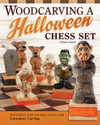 Carved wooden Halloween-themed chess pieces including a mummy, Frankenstein, vampire, and werewolves on a chessboard
