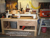 Woodworking bench with lathe, hand tools, and Ridgid power tool in workshop setting