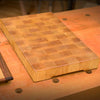 Worn cutting board awaiting an easy DIY refresh to bring it back to its intended beauty.