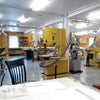 A clean woodworking shop, with well laid-out dust collection.