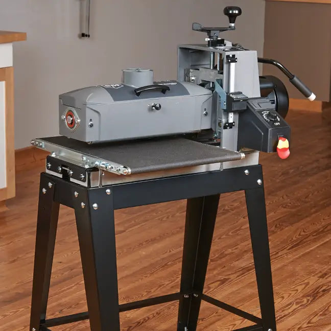Woodworking machine on a stand in a workshop setting