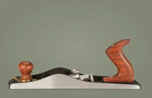 Wooden hand plane on a gray background