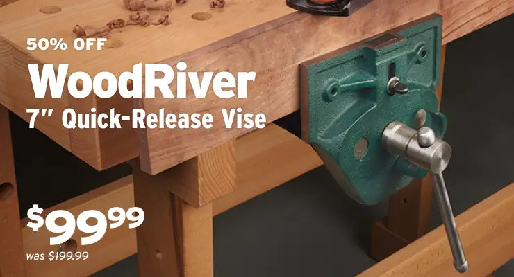 A 7-inch WoodRiver quick-release bench vise mounted on a wooden workbench, with promotional text reading '50% OFF WoodRiver 7
