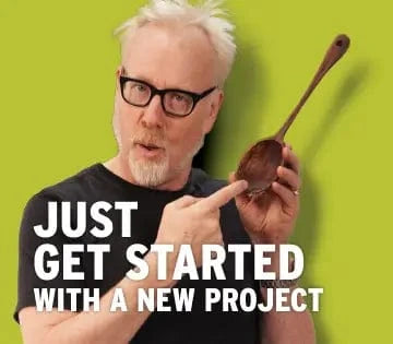 Person holding a wooden spoon with text 'Just get started with a new project' on a green background