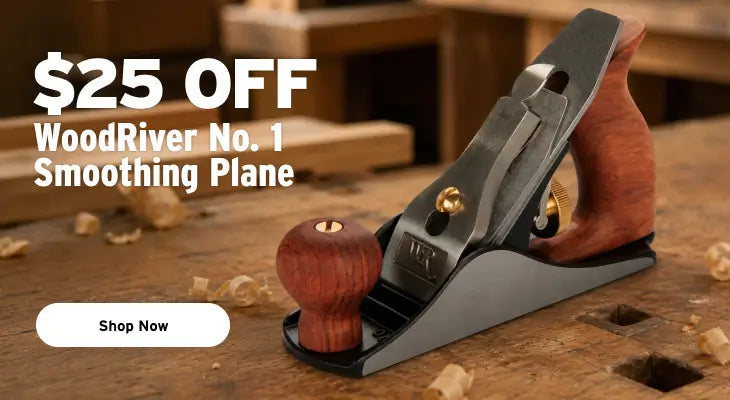 WoodRiver No. 1 smoothing plane with a dark gray metal body and reddish-brown wooden handle and knob, resting on a wooden workbench with wood shavings.