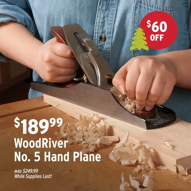 Person using a WoodRiver No. 5 Hand Plane on wood with a discount label.