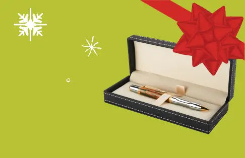 Pen in a black case with a red bow on a green background