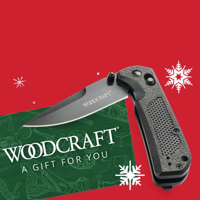 Folding knife with 'Woodcraft' branding on a red background with snowflake graphics.