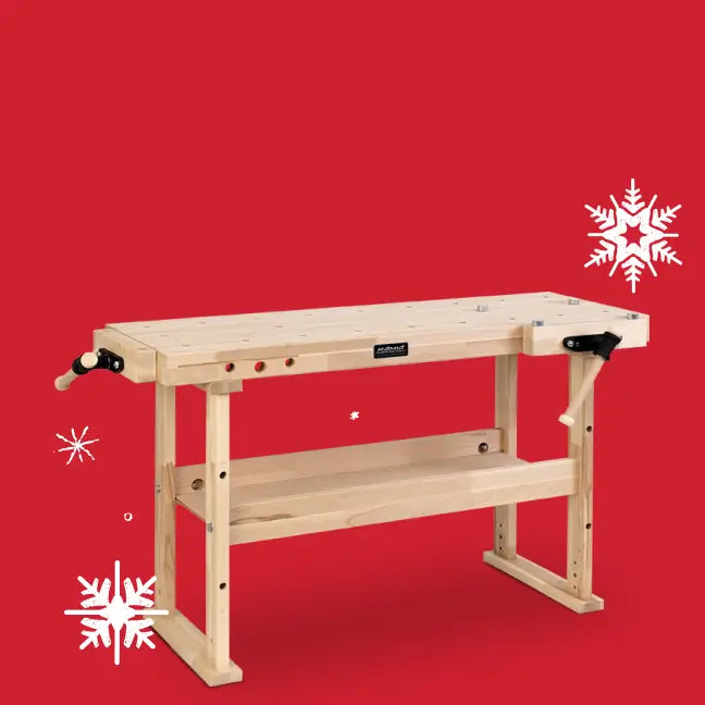 Wooden workbench on a red background with snowflake decorations